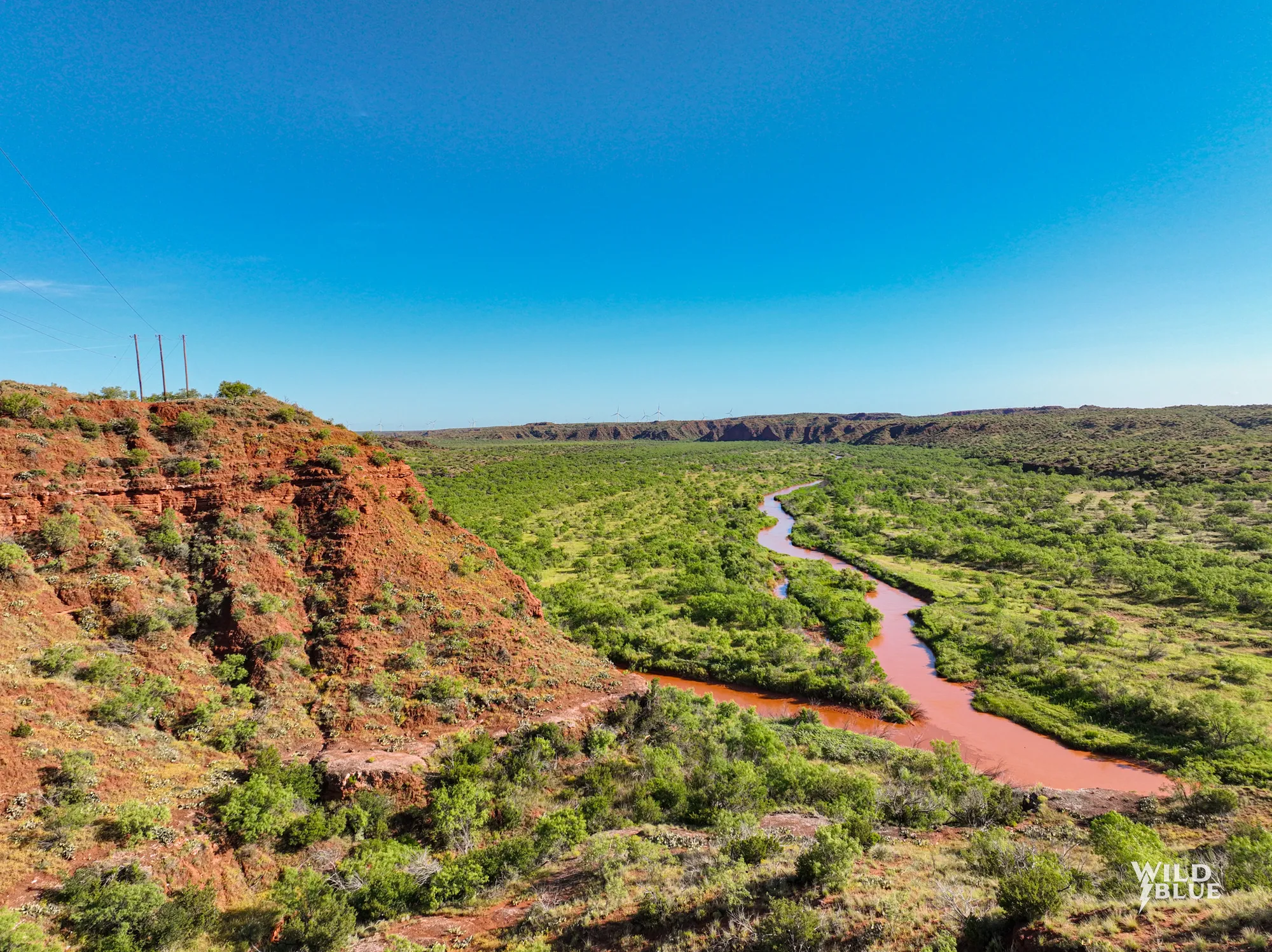 Texas ranch landscape with red canyon and river