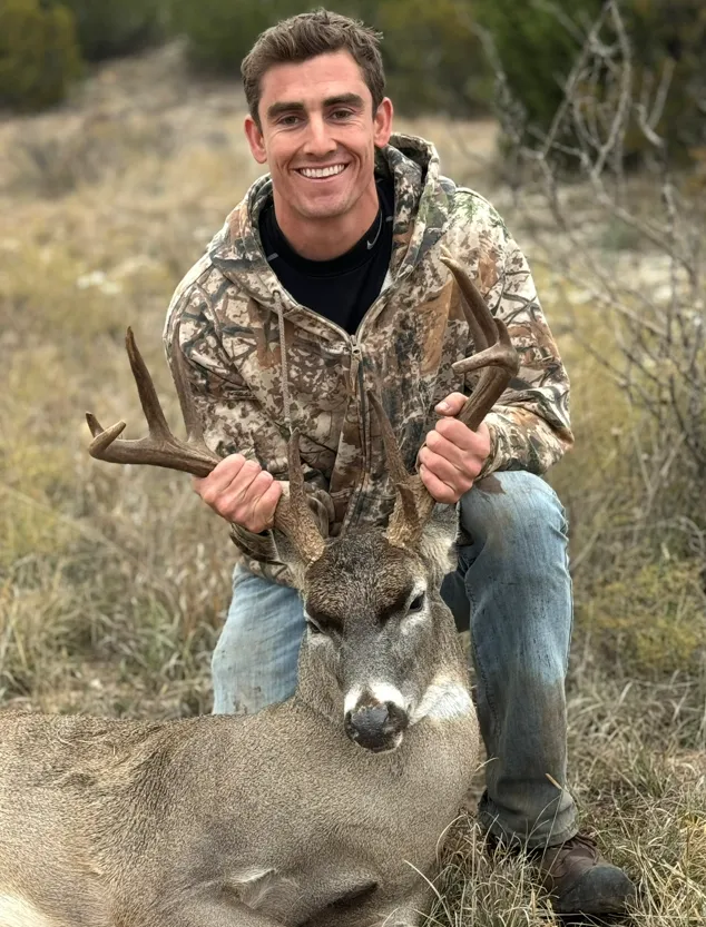 Conner McClellan with trophy whitetail buck