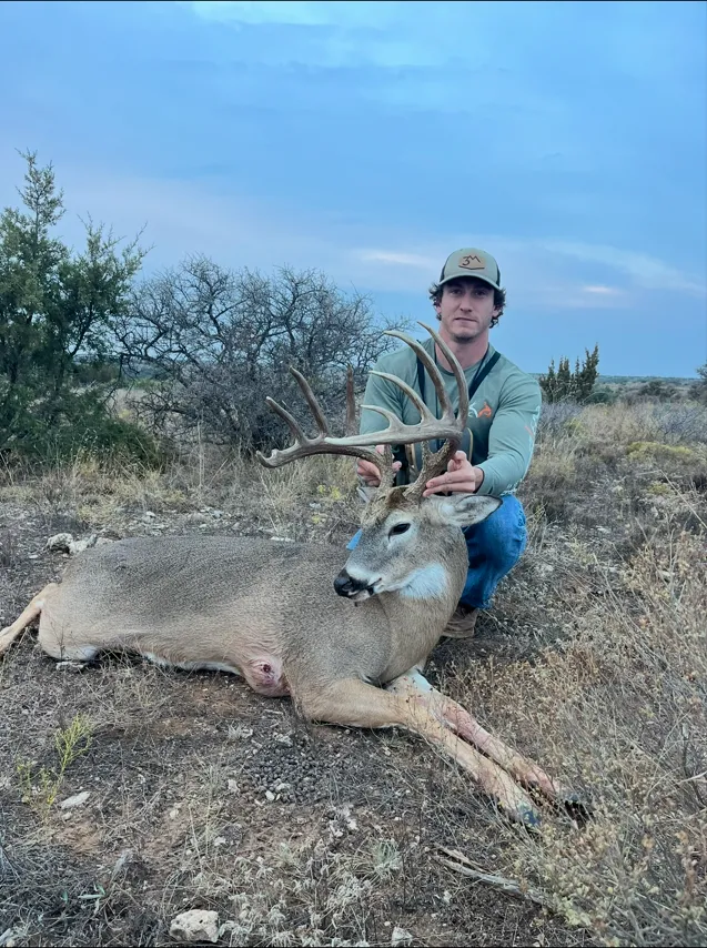 Sam McClellan with trophy whitetail buck