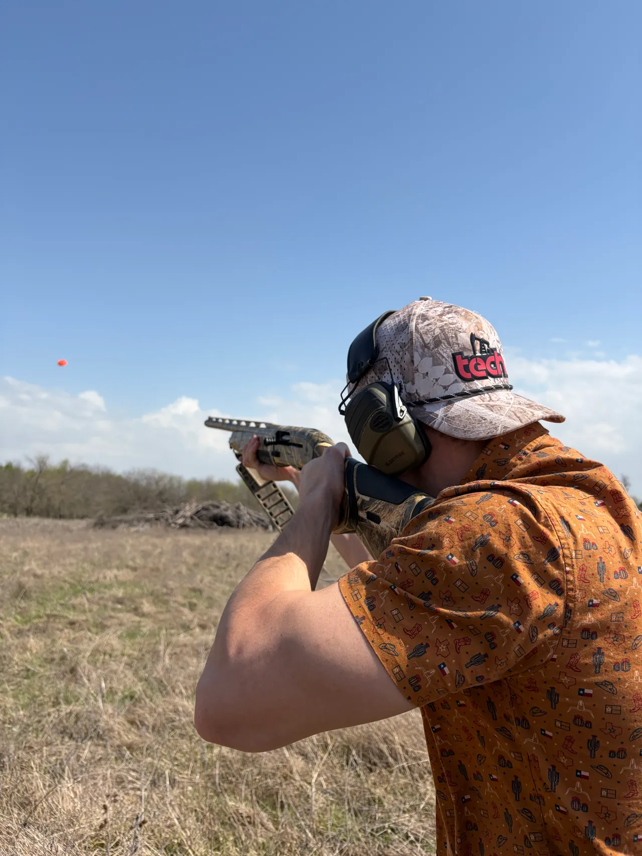 Sam McClellan shooting clay pigeons on Texas land